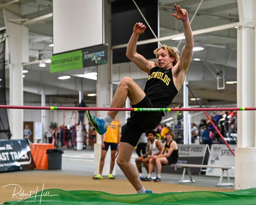 Helmus leaping over the bar in the high jump. Photo provided by Robert Hill