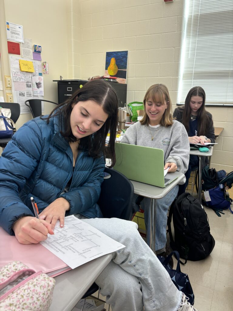 Seniors Charlotte Hubbard and Lilly Greene work on crossword puzzles in Mrs. McAlister's African American Studies class.
